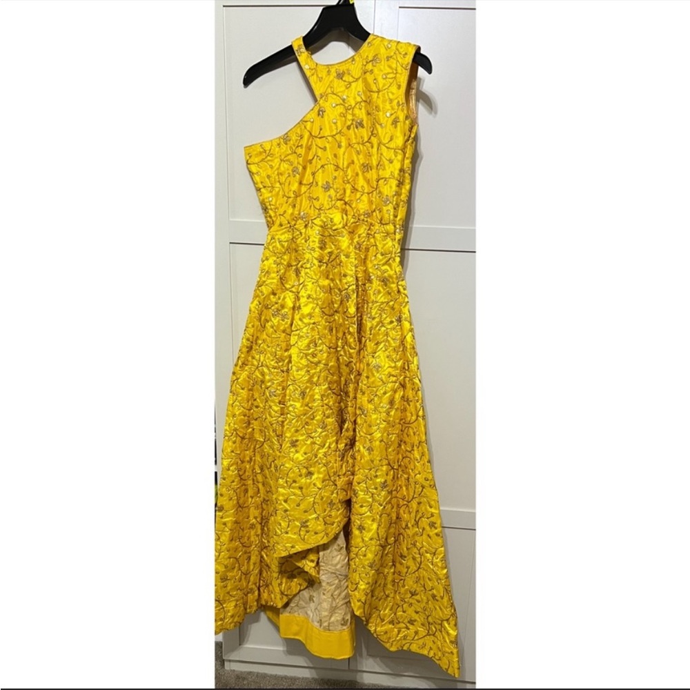 Fashionable one shoulder hi-low gown. Top only.